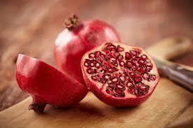 pomegranate-fruit-on-cut-board-royalty-free-image-1578320277.jpg
